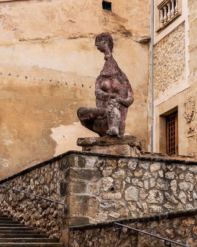 Figura Sentada de Joan Bennassar, stone figure in front of Pollenca City Hall, Majorca, Balearic Islands, Spain