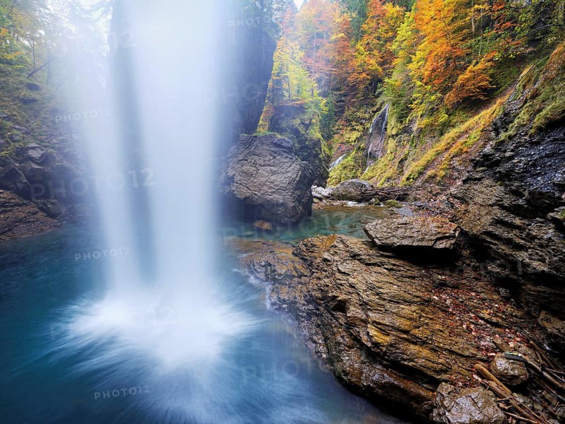 Waterfall mountain list in autumn-colored surroundings, Linthal, Klausenpass, Canton of Glarus, Switzerland