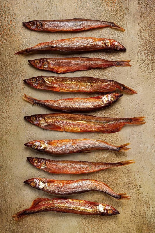 Cold smoked capelin, on the table, top view, no people