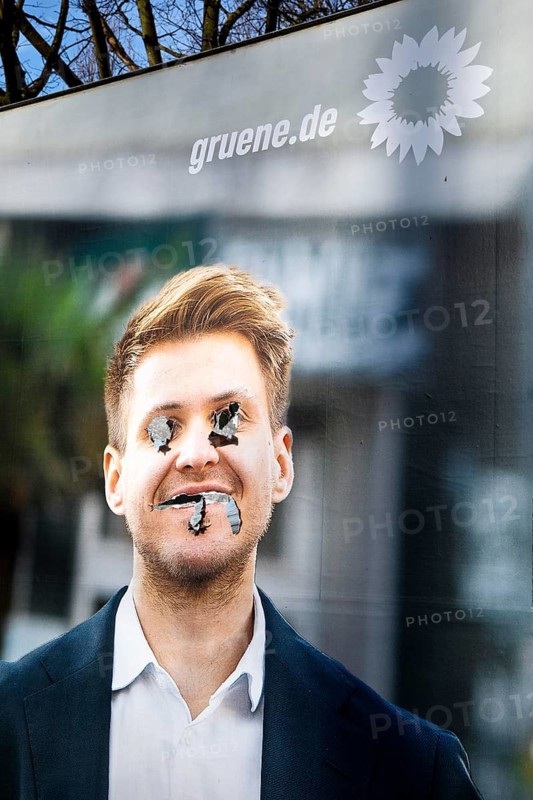 Denigration of a large poster for the 2025 federal election by the Greens with Max Lucks, Bochum, Ruhr area, Germany