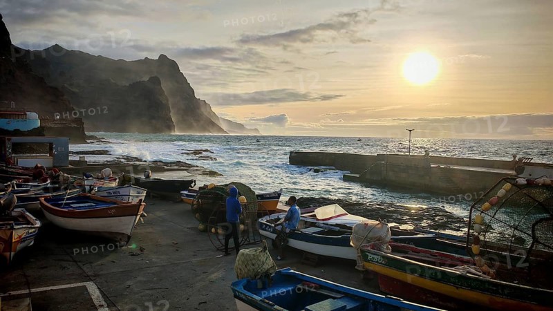 Coastal landscape with fishing boats and setting sun, waves hitting rocks, romantic light, Ponta do Sol, Santo Antao, Cabo Verde, Cape Verde, Cape Verde