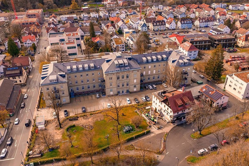 Building complex with adjacent residential buildings and green space, embedded in an urban context, Nagold, Calw district, Germany