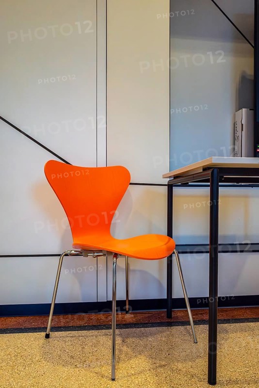 Colourful wooden chairs in the sixties style in a room in the Museum of Communication on Leipziger Straße in Berlin Mitte, Germany