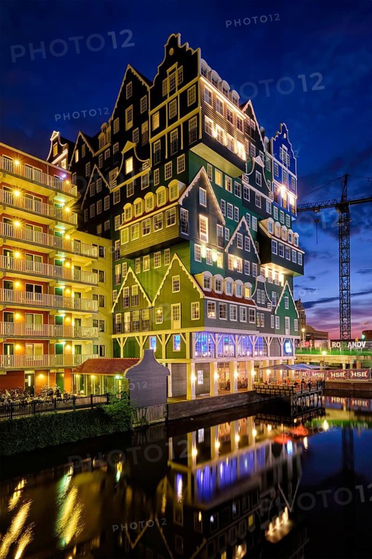 ZAANDAM, NETHERLANDS, MAY 21, 2018: Inntel Hotel in Zaandam illuminated at night. Design of 12-storey tall building opened in 2009 is the result of stacking a series of traditional Dutch houses