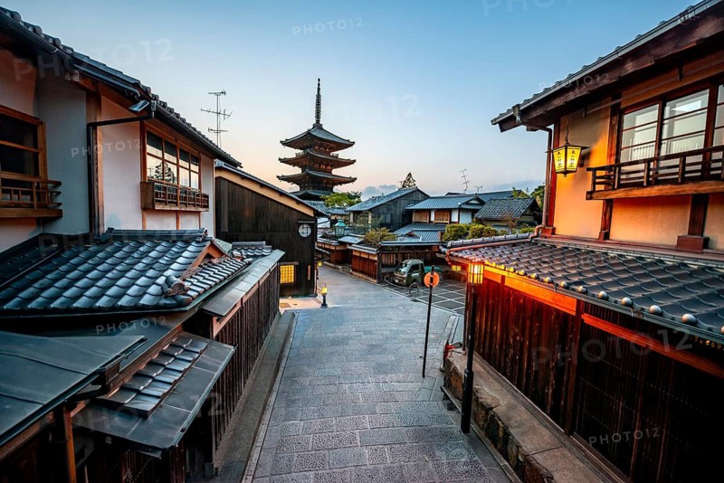 Yasaka dori historic street in the old town with traditional Japanese houses, five-story Yasaka Pagoda of the Buddhist Hokanji Temple at the back, evening mood, blue hour, Higashiyama, Kyoto, Japan