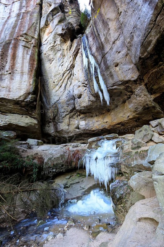 Frozen waterfall with icicles in the Gautschgrotte, Hohnstein, Saxony, Germany