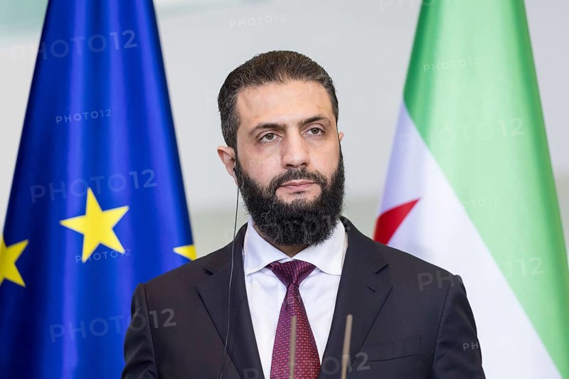 Ahmed al-Sharaa (President of the Syrian Arab Republic) at a joint press conference with Friedrich Merz (Chancellor of the Federal Republic of Germany, CDU) after a one-on-one meeting at the Federal Chancellery, Berlin, 30 March 2026