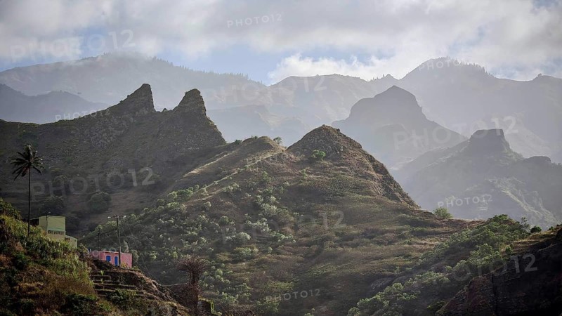 Hilly landscape with small houses and thick vegetation under cloudy skies, spectacular hiking, Santo Antao, Cabo Verde, Cape Verde, Cape Verde