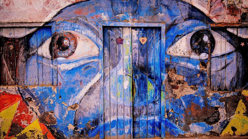 Blue mural on façade and door, graffiti, mural of a face with big eyes, Ponta do Sol, Santo Antao, Cabo Verde, Cape Verde