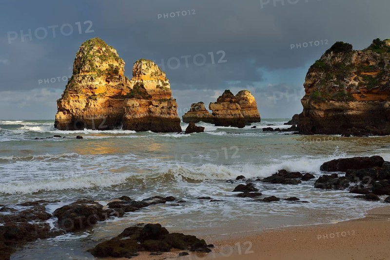 Rock formations on the coast in the evening light, Praia do Camilo, Lagos, Algarve, Portugal