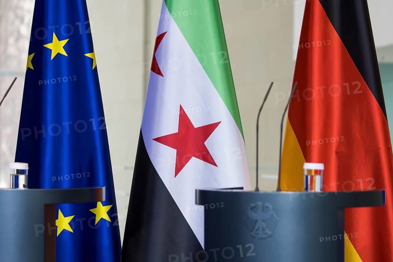 The flags of the European Union, the Syrian Arab Republic and the Federal Republic of Germany in front of a joint press conference by Ahmed al-Sharaa (President of the Syrian Arab Republic) and Friedrich Merz (Chancellor of the Federal Republic of Germany, CDU) at the Federal Chancellery, Berlin, 30 March 2026