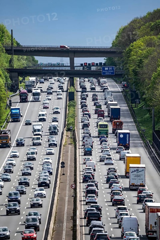 The A3 motorway, heavy traffic on 8 lanes, including the temporarily open hard shoulder, in front of the Hilden motorway junction, looking south, near Erkrath, North Rhine-Westphalia, Germany