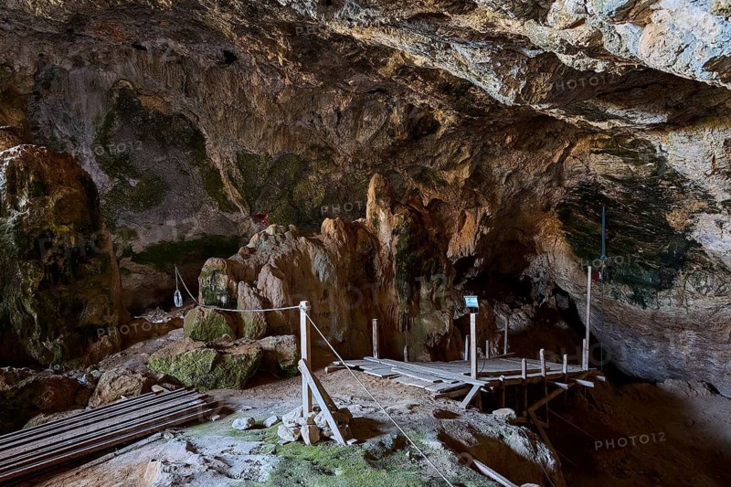 View into an earthy cave with wooden walkways and natural rock structures, Museum, Charkadio Cave, Dwarf Elephant (Palaeolodoxon tiliensis), Elephas Tiliensis, Megalo Chorio, Zero Waste Island, Tilos, Dodecanese, Greek Islands, Greece