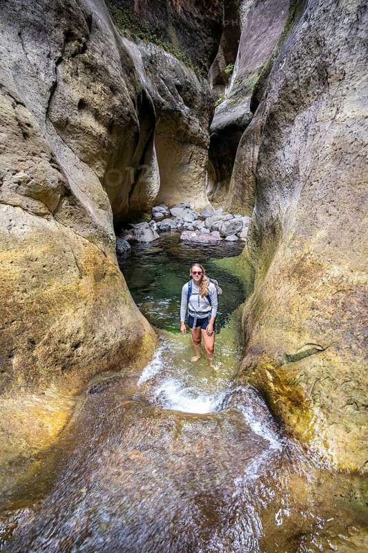 Female hiker in the Tugela Gorge or Tugela Gorge in the riverbed, Drakensberg National Park, KwaZulu Natal, South Africa