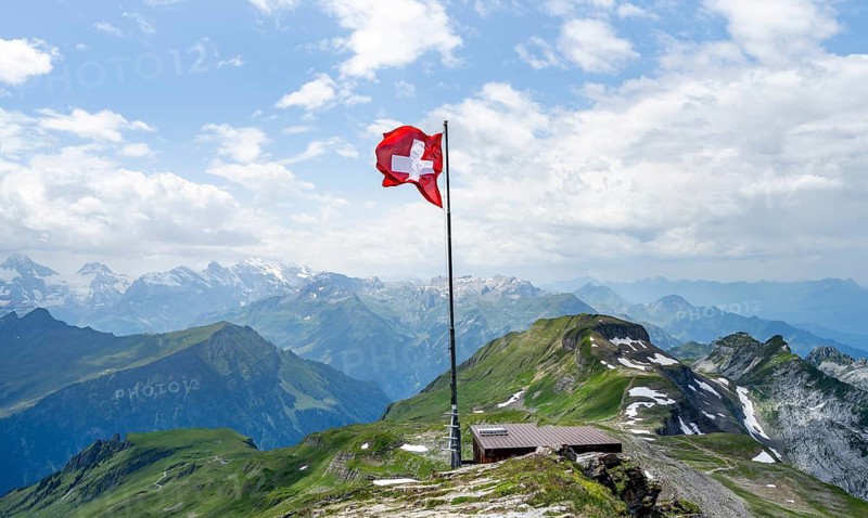 Swiss national flag at the summit of Faulhorn, mountain panorama, Bernese Alps, Bernese Oberland, Switzerland