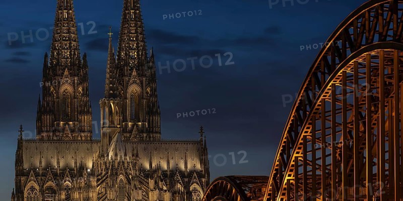 Evening atmosphere, Cologne Cathedral illuminated with LED lamps and the Hohenzollern Bridge, Cologne, North Rhine-Westphalia, Germany
