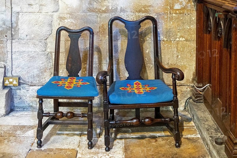 Chairs with decorated cushions, interior view, former abbey church, Tewkesbury, Gloucestershire, England, Great Britain