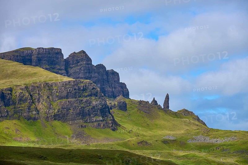 Green mountain landscape with characteristic rocks under a cloudy sky, Old Man of Storr, Portree, Isle of Skye, Scotland, United Kingdom, Great Britain