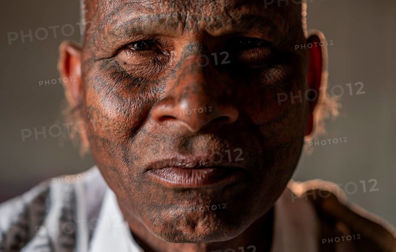 Portrait of a man from the Ramnami sect (Chhattisgarh, India), As a sign of devotion, Ramnami people used to tattoo their body and face with the name of Rama, one of the main hindu god. Nowadays, this tradition is disappearing. Indeed, few of them are still tattooed, the younger generation fearing discrimination. The community (or sect) is born in the end of the 19th century as a way to protest against the supremacy of the higher classes in the hindu hierarchical system. Comprised of low caste hindus, they dont accept the caste system, they practise a form of bhakti (devotion) dedicated to the god Rama