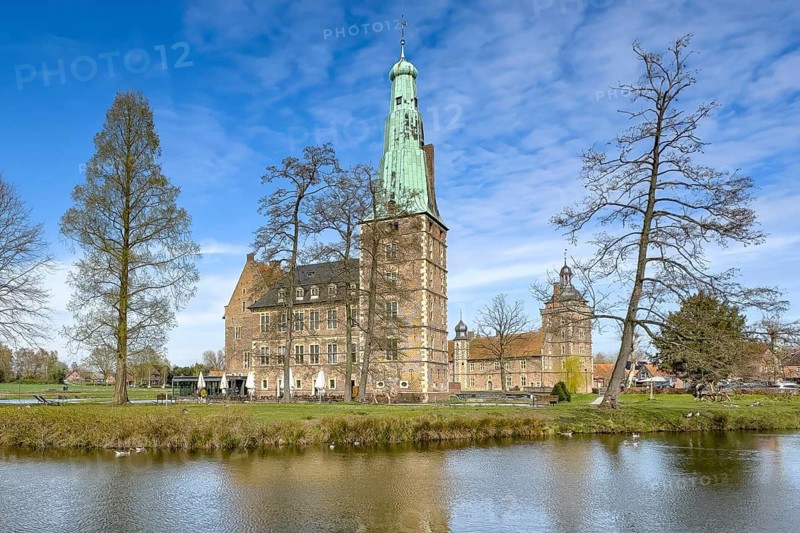View over moat to historic moated castle from Renaissance Raesfeld Castle in spring, Freiheit Raesfeld, Münsterland, North Rhine-Westphalia, Germany