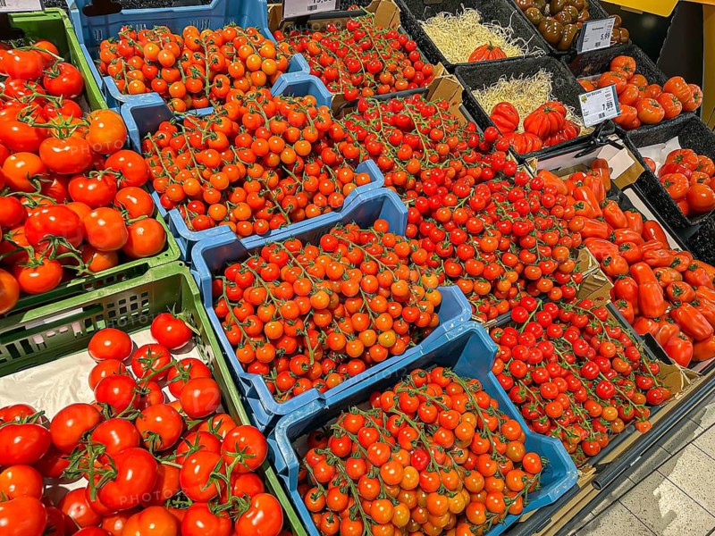 Fruit rack in a supermarket. Tomatoes in various varieties. diversity. Stuttgart, Baden-Württemberg, Germany
