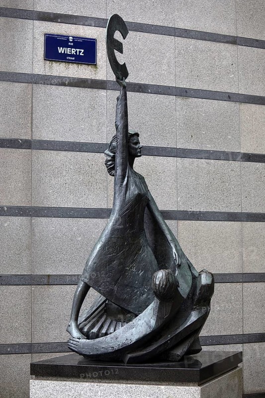The bronze statue entitled Europe by May Claerhout holds up the euro symbol, Rue Wiertz, European Parliament, Brussels