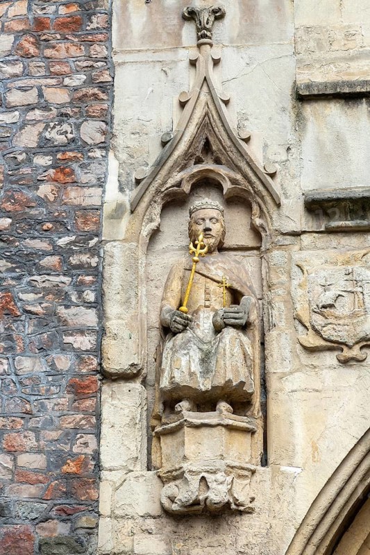 Detail of historic church of Saint John in the Wall, statue of Brennus, Broad Street, Bristol, England, UK