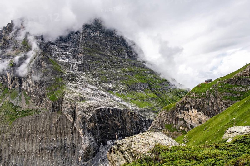 Dramatic mountain landscape covered in clouds, Bernese Alps, Bernese Oberland, Switzerland