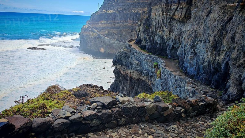 Narrow stone trail, volcanic stone hiking trail along high cliffs with sea views, hiking, Marinha da Cruzinha Natural Park, Santo Antao, Cabo Verde, Cape Verde, Cape Verde