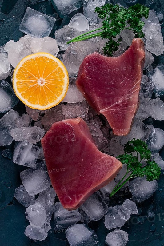 Fresh, raw steak, tuna fish, on ice, top view, close-up
