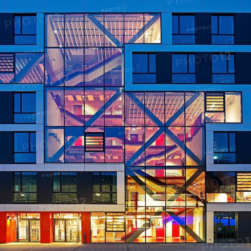 Bochum University seminar building in the evening with an eye-catching staircase with a signal red color scheme, Ruhr area, North Rhine-Westphalia, Germany