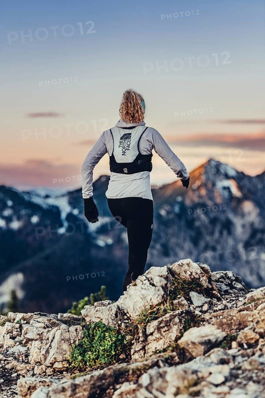 Trail running in autumn on the Jochberg on Lake Walchensee against the wonderful backdrop of the Alps, Bavaria, Germany
