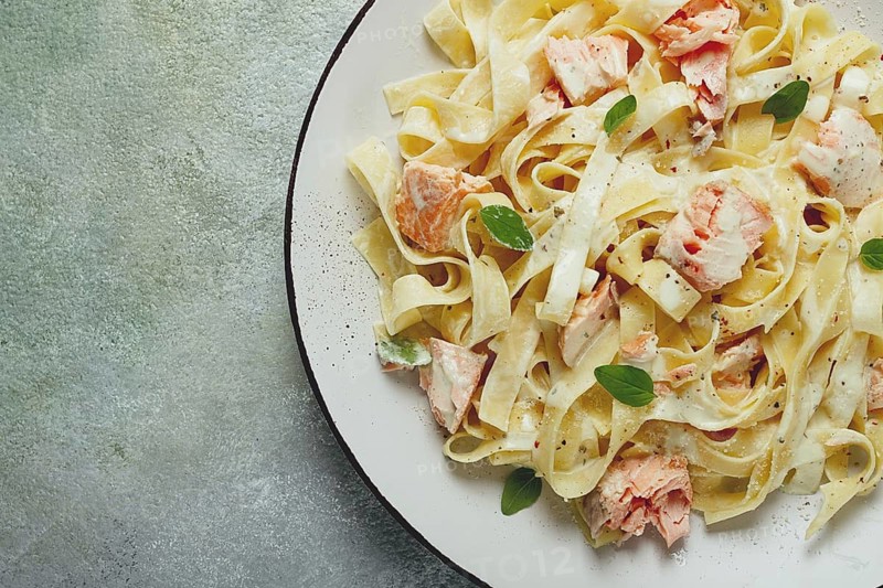 Tagliatelle pasta, in cream sauce with salmon, homemade, no people