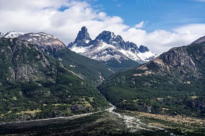 Cerro Palo with snow-covered cliffs, wooded mountain slopes and river valley in the foreground, Cerro Castillo National Park, Aysén region, Patagonia, Chile