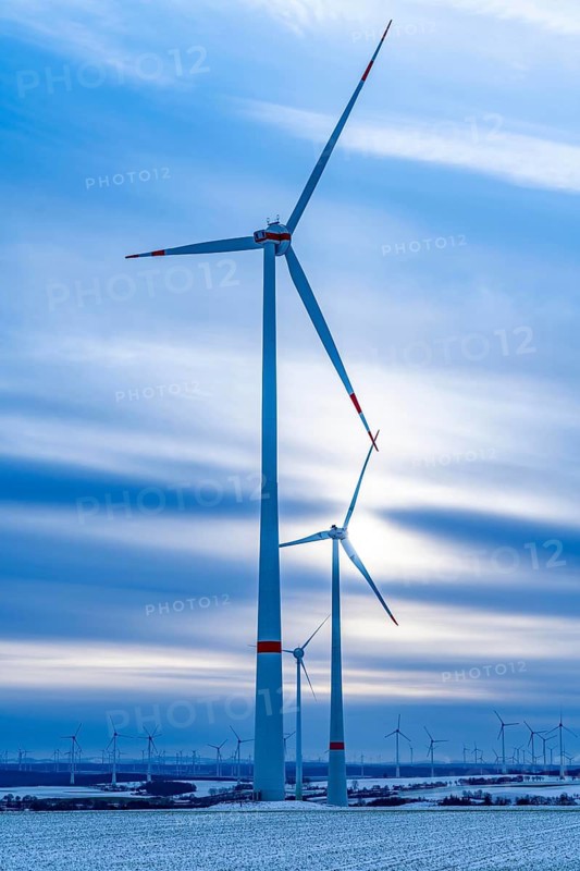 Wind farm, north of Lichtenau, self-proclaimed energy town, over 190 wind turbines and over 1200 solar panels generate 10 times as much electricity as the community of 11, 900 inhabitants consumes, largest onshore cluster of wind turbines in Germany, winter, slightly snow-covered landscape, North Rhine-Westphalia, Germany