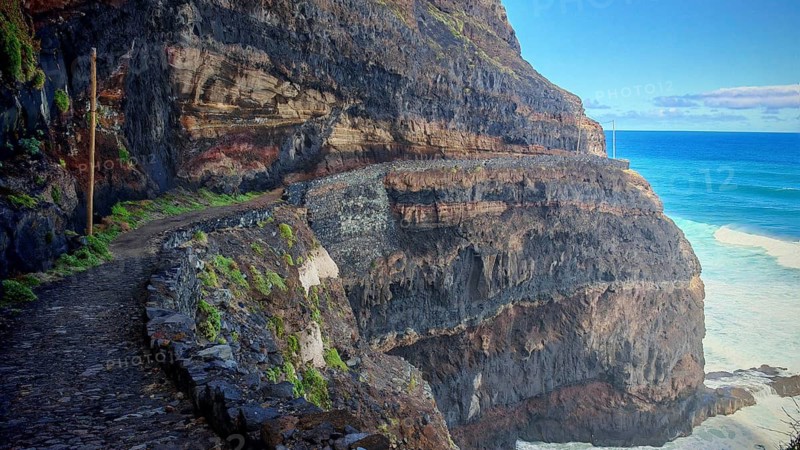 Impressive stone trail along rough, steep cliffs by the sea, hiking, Marinha da Cruzinha Natural Park, Santo Antao, Cabo Verde, Cape Verde