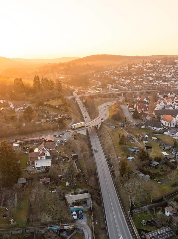 Aerial view of a country road with bridge and surrounding village at dusk, Weil der Stadt, Böblingen district, Germany
