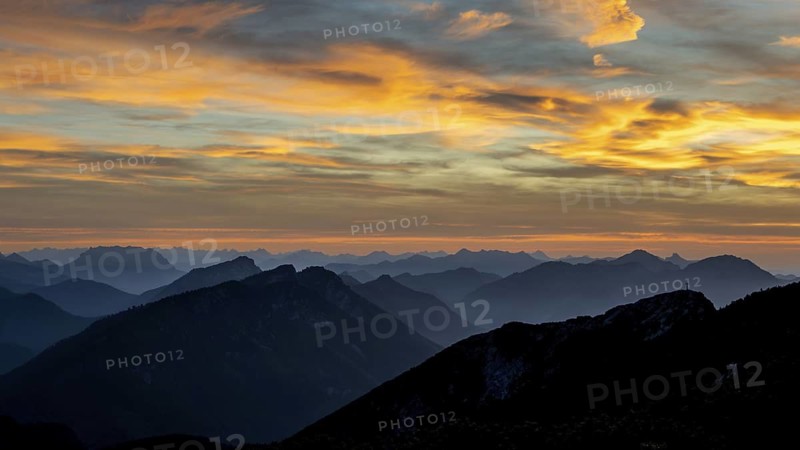Sunset view from the summit of Zwiesel to Gamsknogel and the Chiemgau Alps with Rauschberg and Hochfelln, Upper Bavaria, Germany
