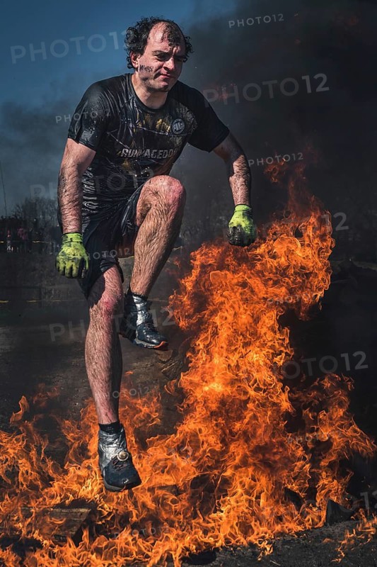 WROCLAW, POLAND - APRIL 7, 2018: Extreme running with obstacle RUNMAGEDDON. In the picture a runner on the Recruit route