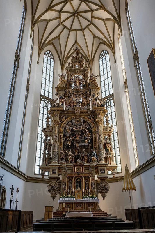 The 23-meter high high altar created between 1604 and 1607 with magnificent carvings and around 270 individual figures in the Basilica of St. Ulrich and Afra, old town of Augsburg, Swabia, Bavaria, Germany