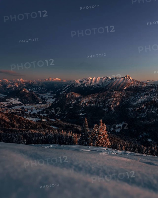 A Winter Wonder Land sunset hiking tour in the snow on the Edelsberg near Nesselwang in the Allgäu in Bavaria, Germany