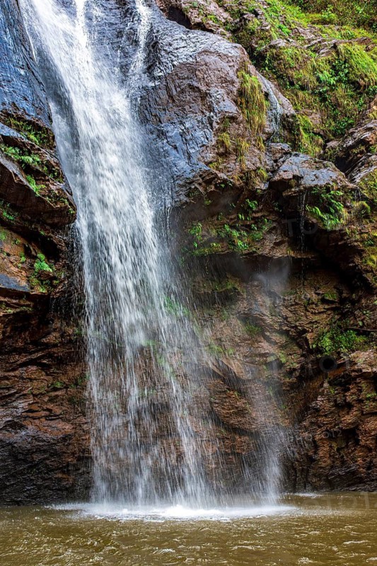 Water from a waterfall splashing between rocks in the state of Minas Gerais, Brazil, Minas Gerais, Brazil