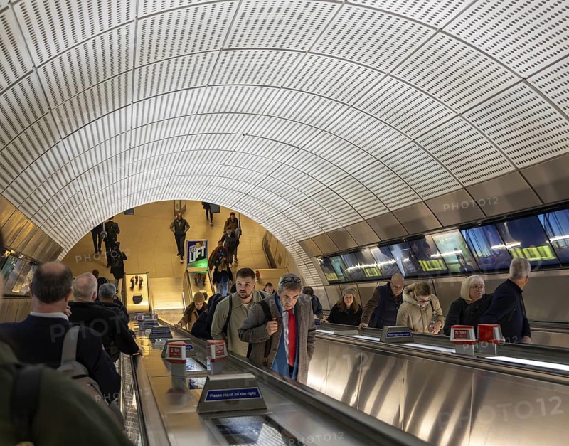 People on escalator Elizabeth Line, Liverpool Street underground railway station, London, England, UK