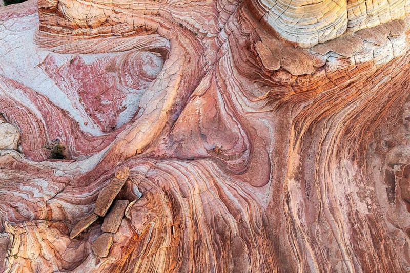 Discover the intricate patterns and vibrant colors of the swirling rock formations in Vermilion Cliffs National Monument, Arizona. A vivid display of natural desert artistry