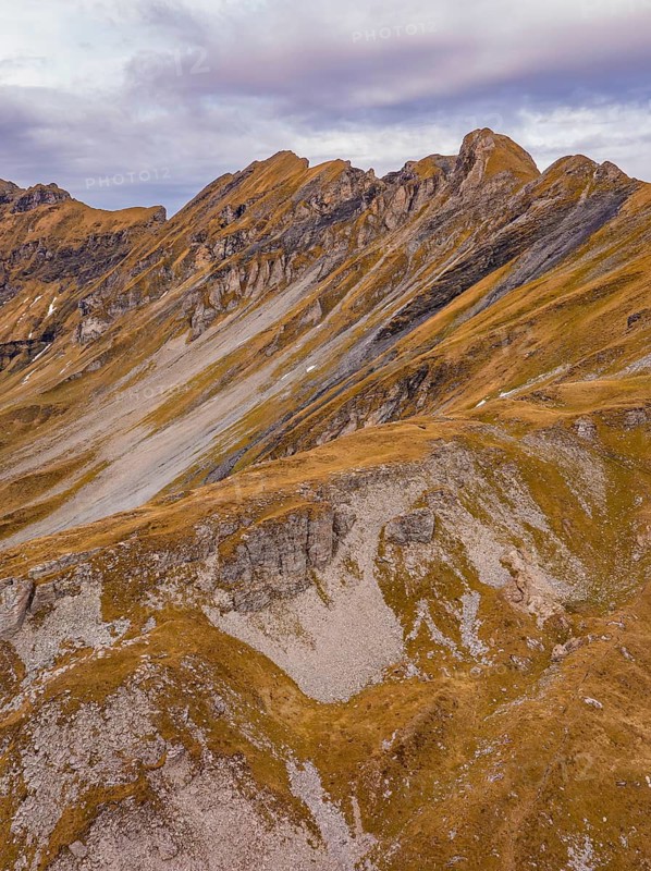 Autumn mountain landscape with barren rocks and cloudy sky, Alpen Tower, Switzerland