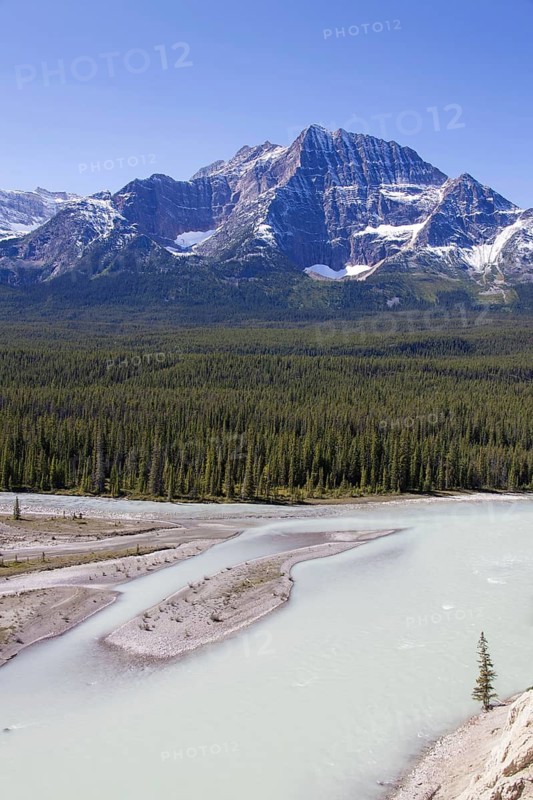 Athabasca River with glacial meltwater carrying rock flour in front of the Rocky Mountains, Jasper National Park, Alberta, Canada
