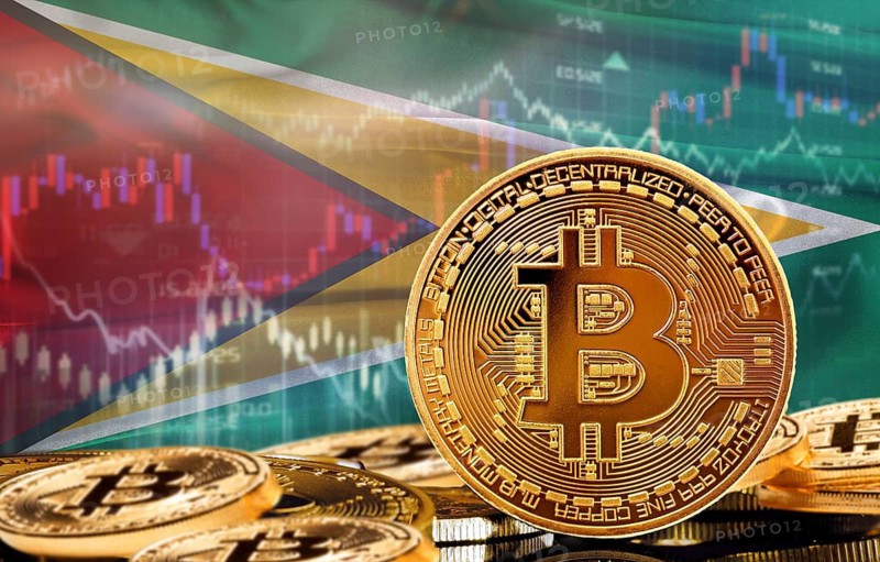Investors in cryptocurrency and Blockchain Technology in Guyana, Concept. Bitcoin with Guyanese flag in the background