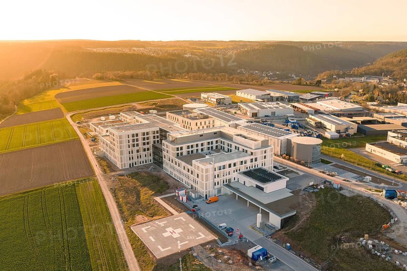 Building ensemble with hospital and fields from a bird's eye view at sunset, new hospital at the Verbund Südwest Clinic, Calw, Germany