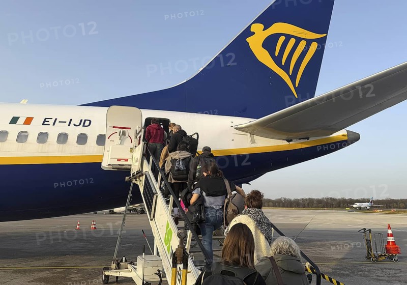 Passengers boarding a Ryanair plane on the tarmac at Cologne Bonn Airport, Cologne, North Rhine-Westphalia, Germany
