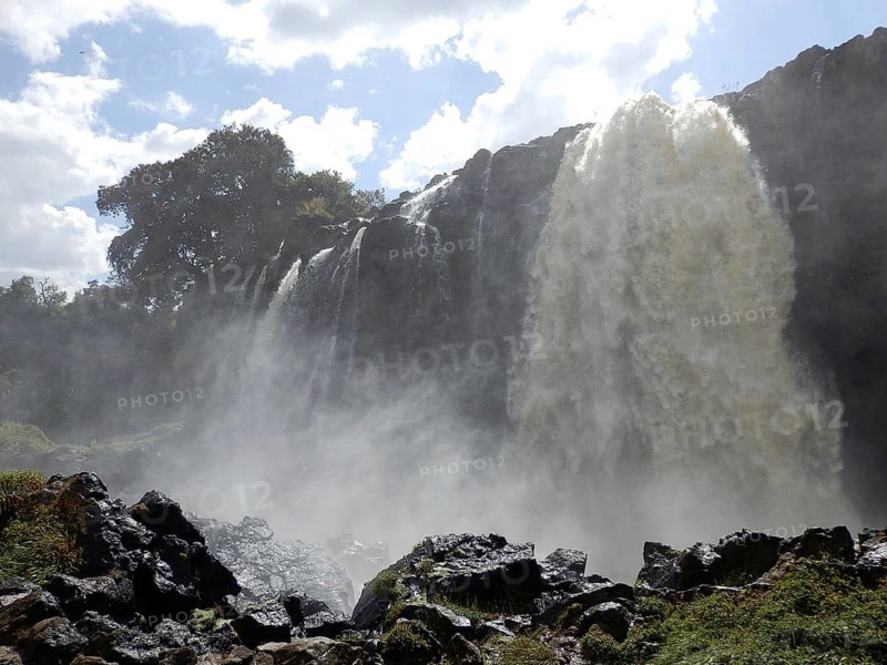 Close-up of Tisissat Waterfall with spray and dramatic lighting, Abbai, Blue Nile, Bahir Dar, Ethiopia
